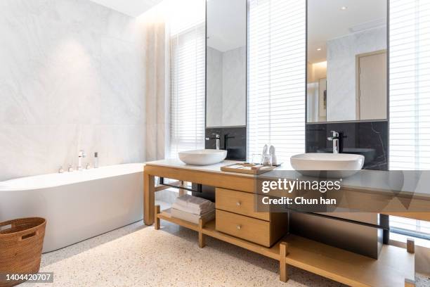 bright and simple washroom sink - hotel bathroom stock pictures, royalty-free photos & images