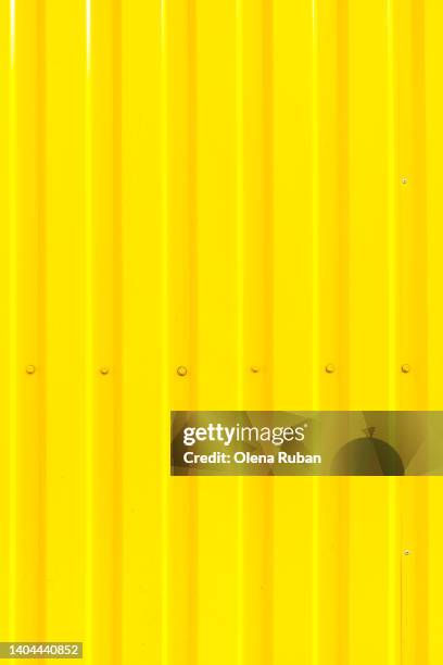 bright yellow iron fence background - gray belt stock pictures, royalty-free photos & images