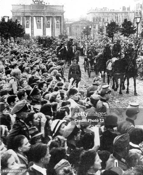 Soldiers who had fought in the Battle of France being welcomed back in Unter den Linden, Berlin. Hitler called it 'one of the most glorious victories...