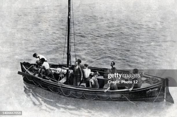 British merchant seamen about to be taken aboard a British warship. After their ship had been sunk, they were adrift in a lifeboat for ten days with...