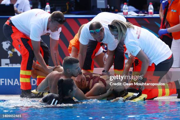 Anita Alvarez of Team United States is attended to by medical staff following her Women's Solo Free Final performance on day six of the Budapest 2022...