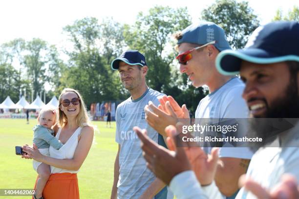 David Payne of England is presented with his first cap by batting coach Mark Alleyne during the 3rd One Day International between Netherlands and...