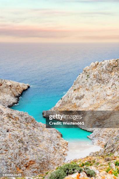greece, crete, seitan limania beach at dusk - crète photos et images de collection