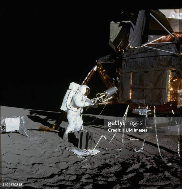 Astronaut Alan L. Bean, lunar module pilot, is photographed at quadrant II of the Lunar Module during the first Apollo 12 extravehicular activity on...