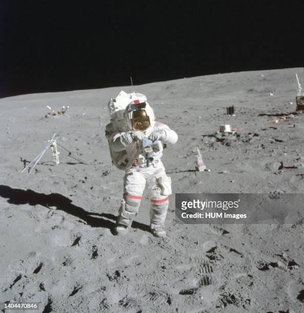 --- Astronaut John W. Young, commander of the Apollo 16 lunar landing mission, stands at the Apollo Lunar Surface Experiments Package deployment site...