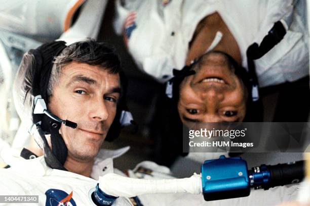 --- Scientist-astronaut Harrison H. 'Jack' Schmitt, lunar module pilot, took this photograph of his two fellow crew men under zero-gravity conditions...