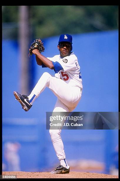 Pitcher Pedro Martinez of the Los Angeles Dodgers prepares to throw the ball during a game against the Montreal Expos at Dodger Stadium in Los...