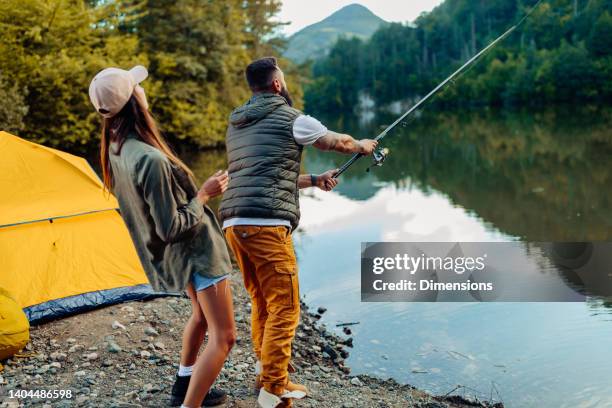 strengthening their bond over a weekend fishing trip - young men fishing stock pictures, royalty-free photos & images