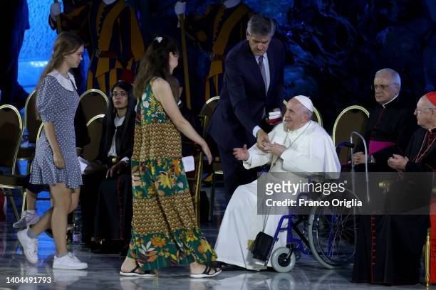 Pope Francis greets girls from Ukraine during the 'World Meeting Of Families' opening at the Paul VI Hall on June 22, 2022 in Vatican City, Vatican....