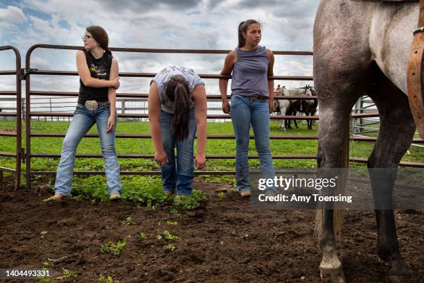 Young members of their extended family take a break from moving cattle at the Blue Heaven Ranch on the edge of the American Prairie Reserve...