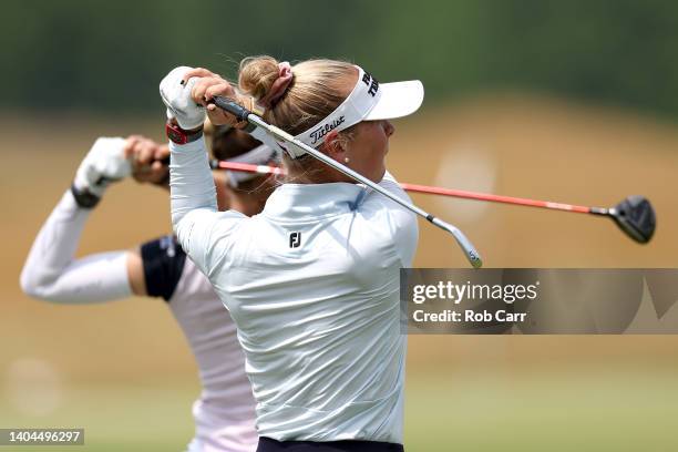 Sisters Nelly Korda and Jessica Korda of the United States hit balls on the range during a practice round ahead of the KPMG Women's PGA Championship...