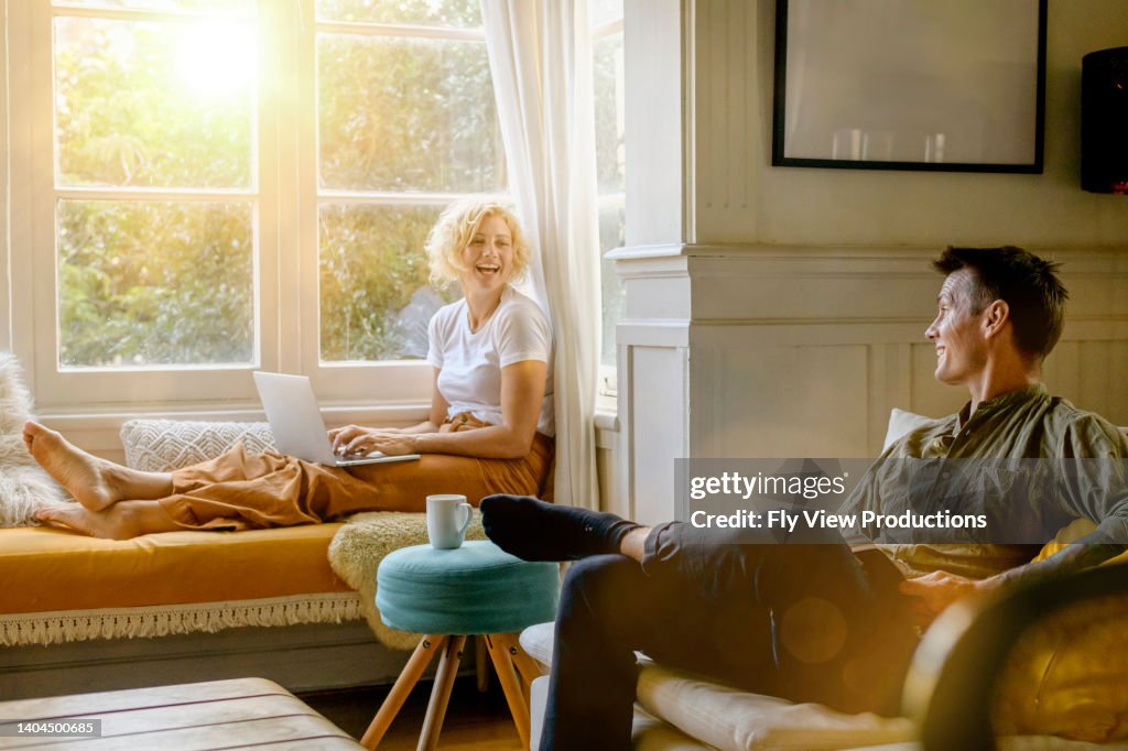 Husband And Wife Relax During The Evening Together High Res Stock Photo husband-and-wife-relax-during-the-evening-together-high-res-stock-photo