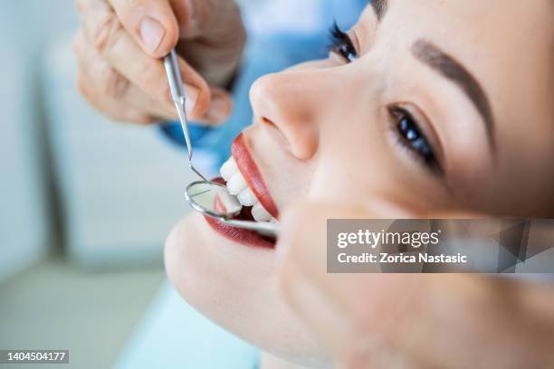 dentist with patient close up - teeth whitening stock pictures, royalty-free photos & images