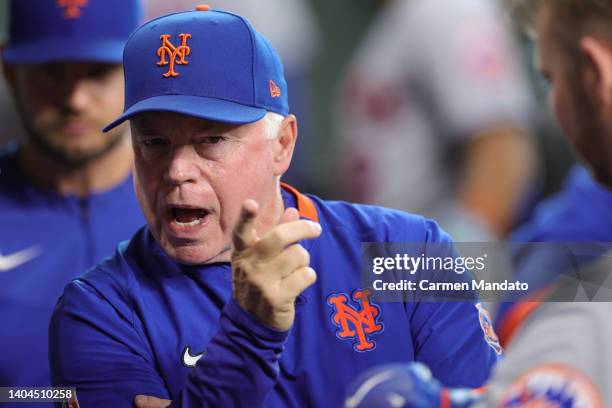 Buck Showalter of the New York Mets looks on from the dugout during a game against the Houston Astros at Minute Maid Park on June 22, 2022 in...