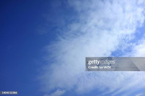 a blue skyscape with light, white clouds over the mediterranean copy space - cirrostratus stock pictures, royalty-free photos & images