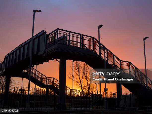 Dramatic winter sunrise silhouettes the railway bridge at Radley Station 5.