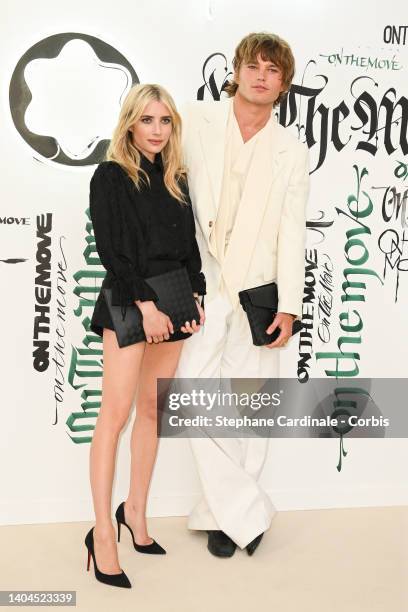 Emma Roberts and Jordan Barrett attend the "On The Move" Montblanc Extreme Launch Photocall At Palais Galliera on June 22, 2022 in Paris, France.