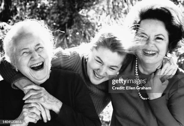 Portrait of English actors Lillian Fontaine and her daughters, Olivia de Havilland and Joan Fontaine , as they share a laugh, Beverly Hills,...