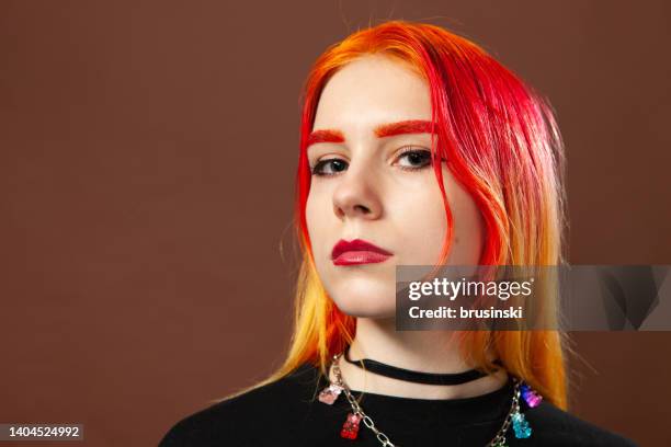 studio portrait of an 18 year old woman with dyed hair - portrait indoors stock pictures, royalty-free photos & images