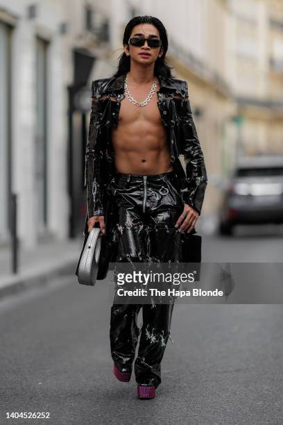 Bretman Rock is seen wearing Sankuanz clothing, Giuseppe Zanotti boots, Prada sunglasses, Coperni bag and GmbH jewelry on June 22, 2022 in Paris,...