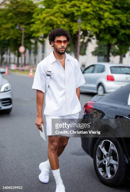 Guest is seen wearing white button shirt, shorts, socks, sneaker outside Givenchy during Paris Fashion Week - Menswear Spring/Summer 2023 on June 22,...
