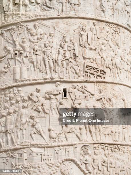 Rome, Italy - October 2014; Trajan's Column is a Roman triumphal column that commemorates the Emperor Trajan's victory in the Dacian Wars. Completed...