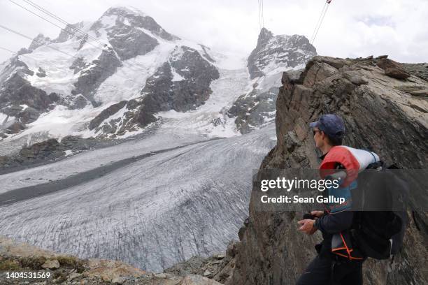 Matthias Huss, a glaciologist with ETH Zurich university and head of the Swiss glacier monitoring network, look out at the receding Lower Theodul...