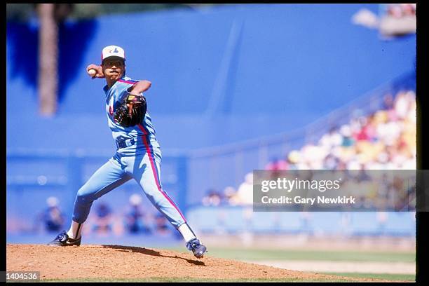 Pitcher Dennis Martinez of the Montreal Expos prepares to throw the ball in a game where he pitched a perfect game against the Los Angeles Dodgers at...