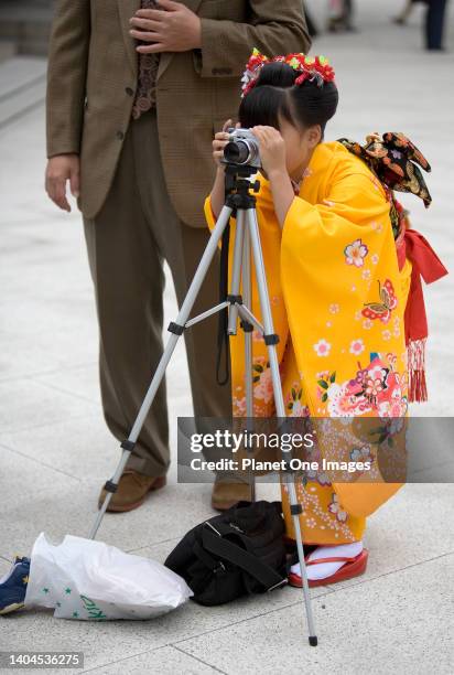 Budding photographer at the Meiji Shrine in Tokyo, Japan.