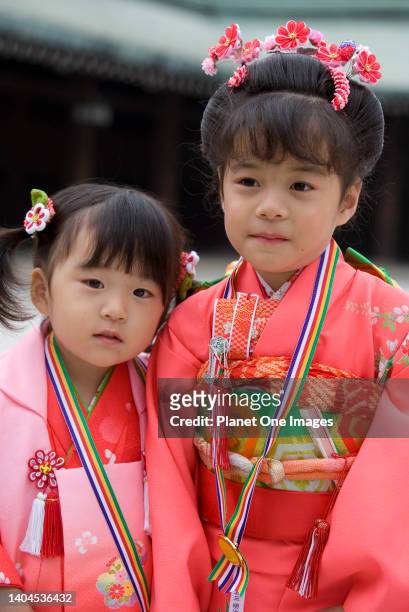Cute sisters in Sunday best - Meiji Shrine Tokyo.