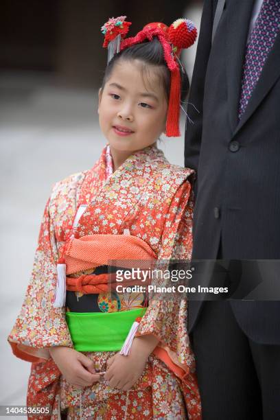 Little girl in kimono with father- Meiji Shrine, Tokyo.