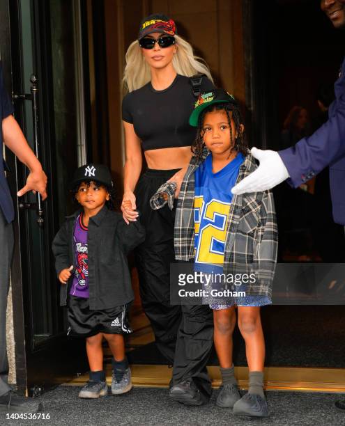 Kim Kardashian, Saint West, and Psalm West depart their hotel on June 22, 2022 in New York City.