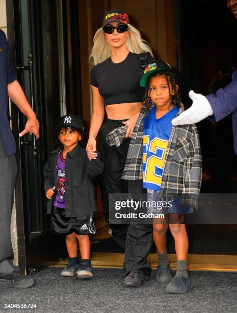 Kim Kardashian, Saint West, and Psalm West depart their hotel on June 22, 2022 in New York City.