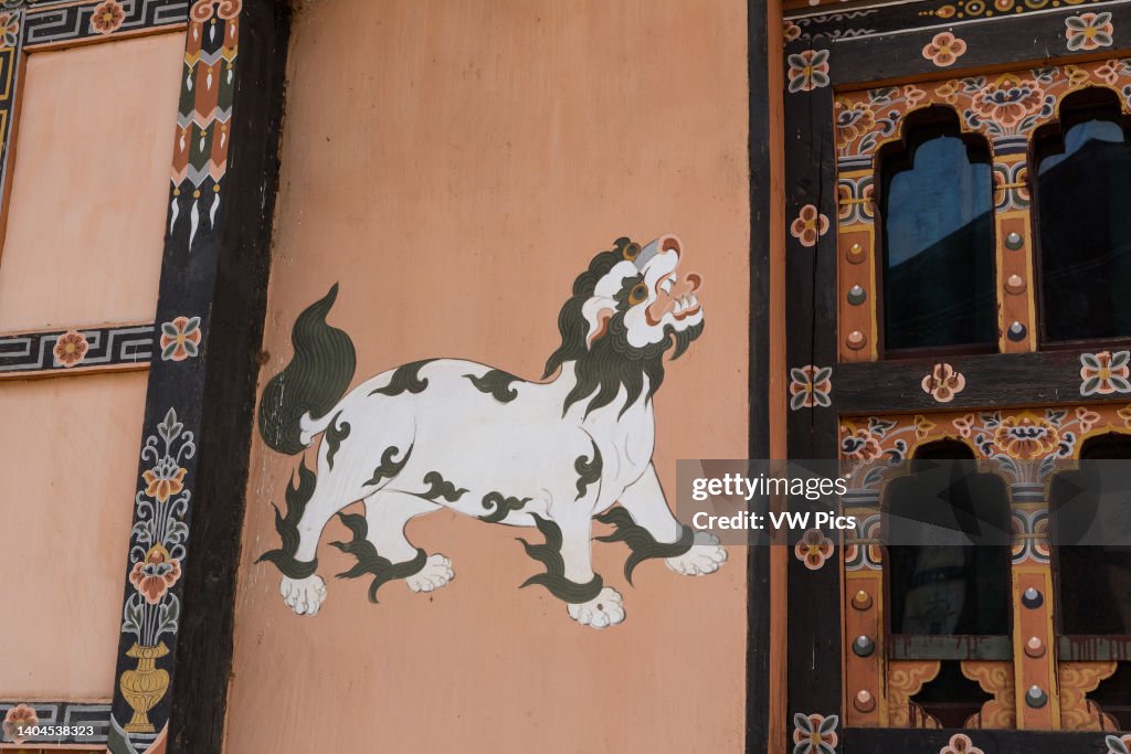 A painting of the mythical snow lion painted on the wall of a house in Bhutan
