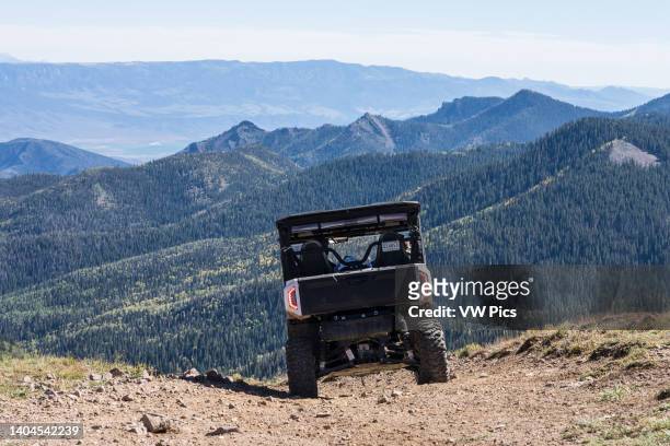 An off-road 4-wheel drive utility all-terrain vehicle on a dirt road in the Tushar Mountains of central Utah.