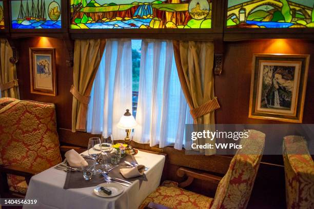 Interior of restaurant car railway carriage of Transcantabrico Gran Lujo luxury train travellong across northern Spain, Europe. First Class dining...