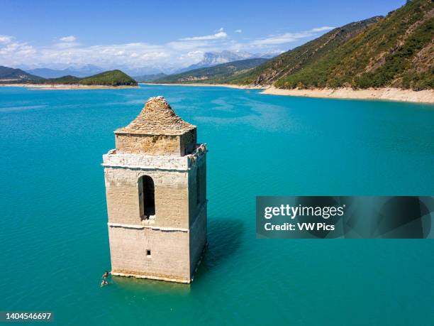 Mediano swamp and tower church submerged under water. View of Sobrarbe Aragon region and Peña Montañesa and the Monte Perdido massif from the Mediano...