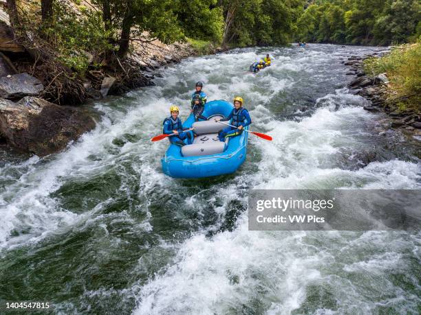 Rafting at Noguera Pallaresa river near LLavorsí at Lleida Province Catalonia, Spain. Located in the heart of the Pyrenees, the Noguera Pallaresa is...