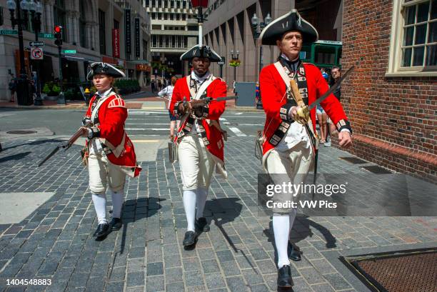 Boston Harborfest Redcoats Soldiers dressed in British Army Uniform reinact a key ceremony parade in front of The Old State House Boston...