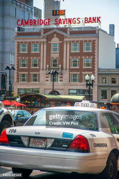 Cambridge saving bank and taxi near Harvard university and Harvard Square, Cambridge, Boston, Massachusetts, USA.