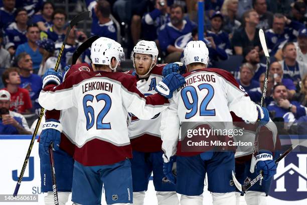 Gabriel Landeskog of the Colorado Avalanche celebrates with teammates after scoring a goal against Andrei Vasilevskiy of the Tampa Bay Lightning...