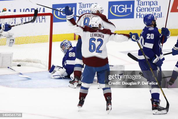 Artturi Lehkonen of the Colorado Avalanche reacts after Gabriel Landeskog scores a goal against Andrei Vasilevskiy of the Tampa Bay Lightning during...