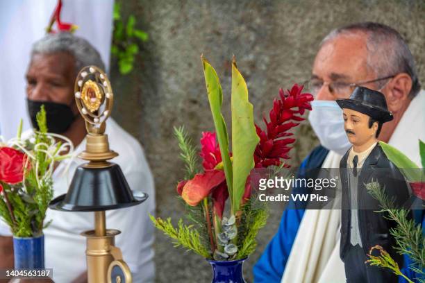 Priest prays and says a prayer with the relic of the Blessed in a popular area of Caracas. Relic of Blessed Jose Gregorio Hernandez. Caracas,...