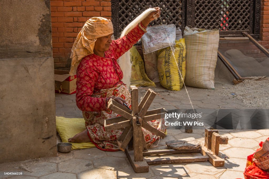 Medieval Spinning Wool Rack A Nepali woman spins wool thread with a hand-cranked spinning wheel ...