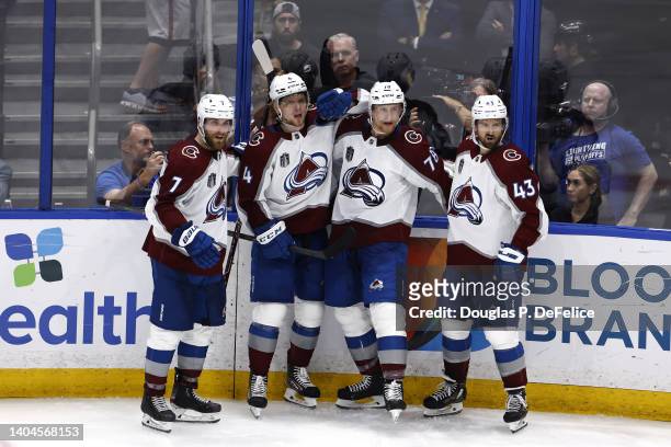 Nico Sturm of the Colorado Avalanche and teammates celebrate a goal against Andrei Vasilevskiy of the Tampa Bay Lightning during the third period in...