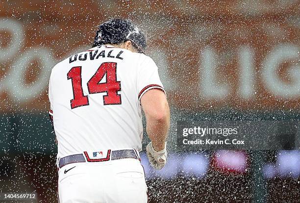 Adam Duvall of the Atlanta Braves celebrates hitting a walk-off single to score the winning run by William Contreras in the ninth inning against the...
