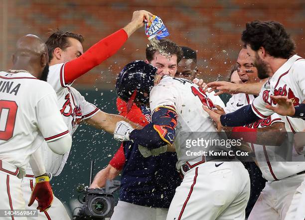 Adam Duvall of the Atlanta Braves celebrates after hitting a walk-off single to score the winning run by William Contreras in the ninth inning...