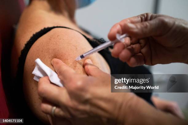 Injection of the third dose of the covid 19 vaccine at a Covid-19 vaccination center in Dinan, Brittany. France.