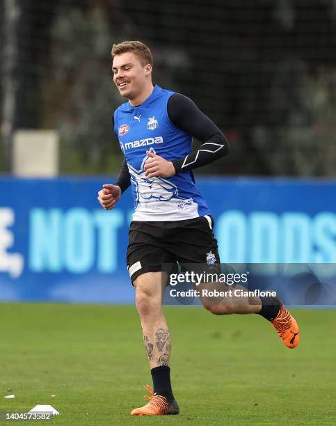 Cameron Zurhaar of the Kangaroos warms up during a North Melbourne Kangaroos AFL training session at Arden Street Ground on June 23, 2022 in...