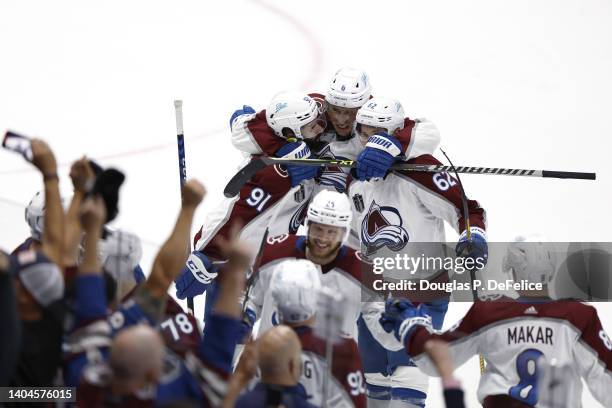 Nazem Kadri of the Colorado Avalanche celebrates with teammates after scoring a goal against Andrei Vasilevskiy of the Tampa Bay Lightning to win 3-2...